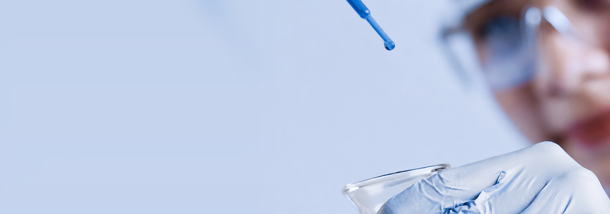 Pipette dropping into a flask